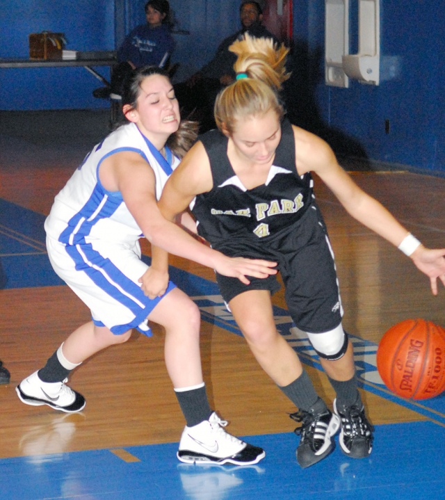 Conchita Valdez #20 blocks for Jaynessa Lopez during the game against Oak Park.