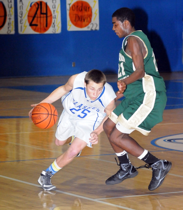 Corey Cole #25 dribbles around his opponent at Friday, February 18, CIF game.