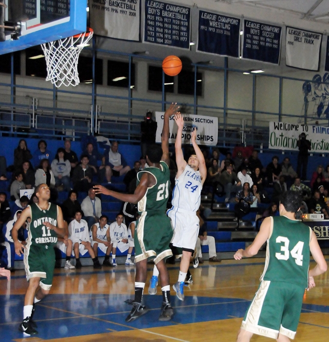 Angel Barajas #24 shoots to score. Barajas contributed 15 points to the game.