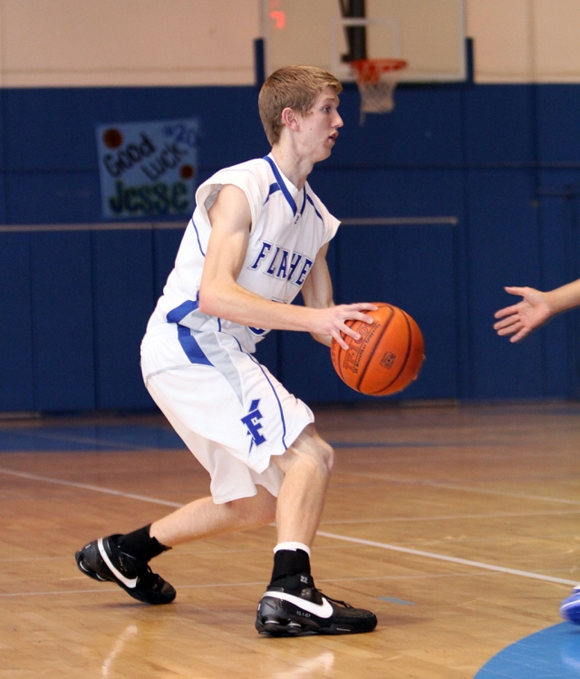 Collin Cone passes the ball to his teammate. Fillmore lost to Price 59-76.