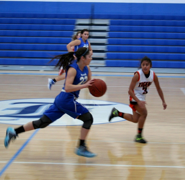 Anyssa Cabral with a fast break to score 2 points with teammate, Kayla Grove. Anyssa had 12 points, 2 rebounds and 3 steals against opponent Roseville, California.
