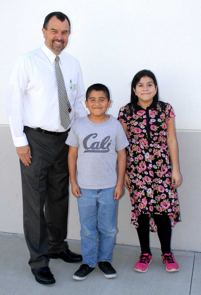 Thirty two students competed Tuesday to earn the title of Mountain Vista School Spelling Bee Champion. There was tense anticipation when only three competitors remained on stage in the 5th round. Five rounds later, Marco Gutierrez was declared winner with runner-up Jazmin Aguirre. Marco’s championship word was “marathon.” The next stage in the competition is Ventura County Spelling Bee at CSUCI campus on March 5. That winner will compete at the national competition in Washington, D.C. Mr. Wilber, Mtn. Vista Principal, with Spelling Bee Champion Marco Gutierrez and runner-up Jazmin Aguirre.