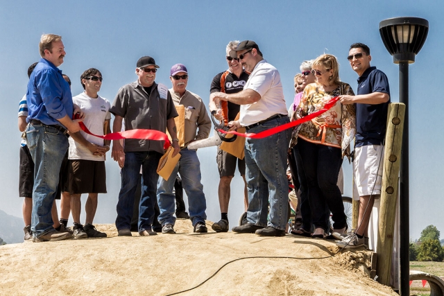 The Fillmore Two Rivers Park Pump Track/Bike Park held its grand opening on Saturday, March 21st, 2015, at noon. The City of Fillmore, City Council and Parks & Recreation Commission invited the public to join them for the much anticipated ribbon cutting. Attending the opening ceremony were Councilmember Rick Neal, Rusty Cochran (Grimes Rock/State Ready Mix), Greg Taylor (MG Taylor Equipment), Hans Kiefer (Bellfree Contractors), Mayor Douglas Tucker, Councilmember Carrie Broggie, Camilla Conaway (Parks and Rec Commissioner), Councilmember Diane McCall, and Councilmember Manuel Minjares. A Cobra Rep also attended. The City of Fillmore especially wants to thank Rusty, Greg and Hans for their generous contributions. The Pump Track/Bike Park is a professionally designed facility giving cyclists a safe, off street place to learn to ride, practice and increase cycling skills. The track consists of pump tracks, skills areas, trails area, a practice trail, and jump line. The skills, trails and jump areas will contain features designed to build riding skills such as balance, pedaling, shifting, braking, etc. in a safe, controlled and progressive environment. Everyone from the age of 2 to 102 years old who can ride a bike, is invited to come out and ride! Photos by Bob Crum.