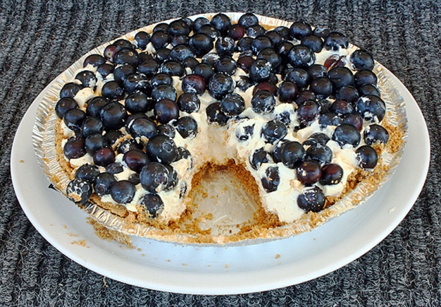 Bob Crum's famous two-minute, irresistibly scrumptuous graham cracker crust blueberry 
cheesecake. Oh sooooooooooo good! 

Bob's SECRET two-minute cheesecake recipe... free for Gazette readers. 

One Keebler 9-inch Graham Cracker Ready Crust...
One 24.3 oz container of Philadelphia Ready-to-Eat Cheesecake filling...
Bunch of freshly picked blueberries...

Remove plastic protective cover from Ready Crust...
Remove top of Ready-to-Eat Cheesecake filling...
Dump cheesecake filling onto Ready Crust...
Spread cheesecake filling with spatula...
Spread blueberries around the top of cheesecake filling and gently press in.
Cheesecake is now ready to eat. Time: 2 minutes.

Now... cut the cheesecake into slices... remove only ONE slice and place on plate. 
ENJOY! 

Bet you can't eat just ONE slice. That's OK... you have my permission to indulge. But no more than two slices at one sitting. OR ELSE!

Photo by Bob Crum. Photo Copyright Greatography™ by Bob Crum. All Rights Reserved.