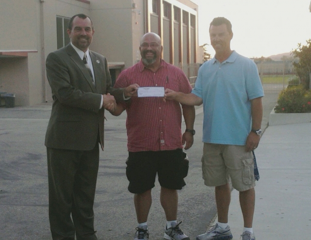 The Fillmore Athletic Booster Club president Max Pina (center), presented a check for over $8500 to Principal John Wilber and Athletic Director Matt Suttle. The proceeds were from the March 17th Casino Night the club put on for the Athletics Department.