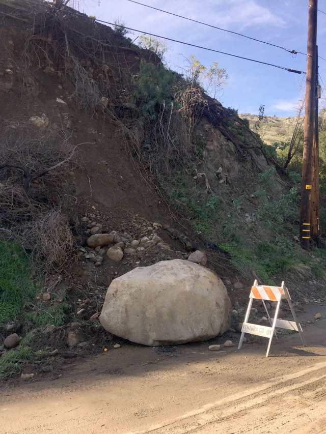 A large boulder slid down the hill at the end of Grand Avenue and came to a stop in the road during last week’s storm. Photo courtesy Katrionna Furness.