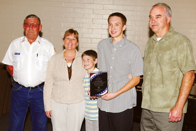 Eagle Scout Sean Chandler, Troop 406, is pictured at the VFW meeting Tuesday night. Sean received a plaque for his Eagle Scout project: to build a Walk of Honor at Bardsdale Cemetery. Sean and the other Scouts removed aging asphalt walkway near the flagpole and replaced it with bricks, many engraved with the names of veterans from our community. The primary goal of Sean’s project was to give Fillmore area residents the opportunity to honor those who have served our nation. A plaque was installed at the base of the flagpole honoring all veterans.