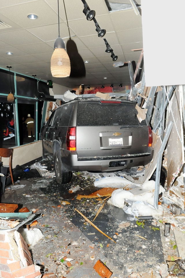 At approximately 7:07 p.m. on Tuesday December 13th, 12 Fillmore Fire units responded to a vehicle collision at Starbucks in Fillmore at the corner of A street and Highway 126. A Chevrolet Tahoe had crashed through the east wall of the business, near the drive thru, pinning several people against tables and walls. Eye witnesses said the vehicle was traveling about 50 miles per hour when it struck the building’s exterior wall. The driver identified himself as a Los Angeles Sheriff’s Department deputy. He stated he had fallen asleep and veered from the westbound lanes of Highway 126 (Old Telegraph Road) across the eastbound lanes, over the sidewalk, across the parking lot for approximately 100 yards, between two large palm trees before crashing through Starbucks east wall. The vehicle traveled completely through the front lounge coming to rest against the front door and corner. One unidentified man who was sitting in a large brown chair on the east wall of the building near the point of impact was pinned against the front door on the opposite side of the dining area. His injuries were reported to be critical. Two other patrons were seriously injured when they were pinned against the south wall of the dining area. All three persons were extracted by the Fillmore Fire Department and transported a local hospital, according to Fire Chief Rigo Landeros. We will have an update as more information becomes available.