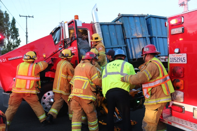 On Sunday morning, August 31, at 6:15am, a Bakersfield-based, HONDO, Inc. 18-wheeler experience a load-shift. The cargo containers appeared to have broken loose from the strapping system, allowing the containers of sulphur to shift forward, crushing the cab. It was reported that each container weighed one ton. The driver was extracted from the cab by Fillmore Fire. As of press time there was no report of his condition. Photos courtesy Sebastian Ramirez.