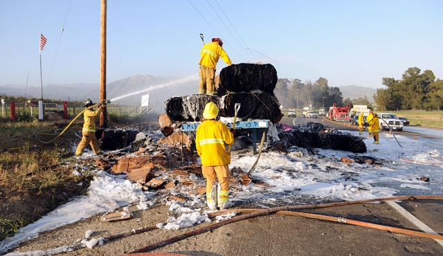 A truck pulling two flatbed trailers loaded with bails of cardboard caught fire near Old Telegraph Road. No damage was caused to the truck, but the cargo was mostly destroyed.