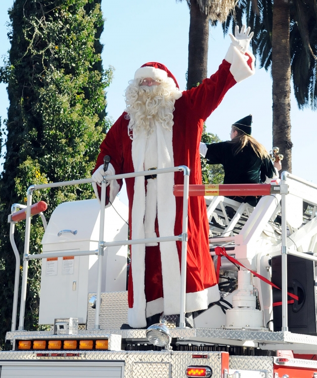 Santa Claus waves to the crowd during the FIllmore Christmas Parade last Saturday.