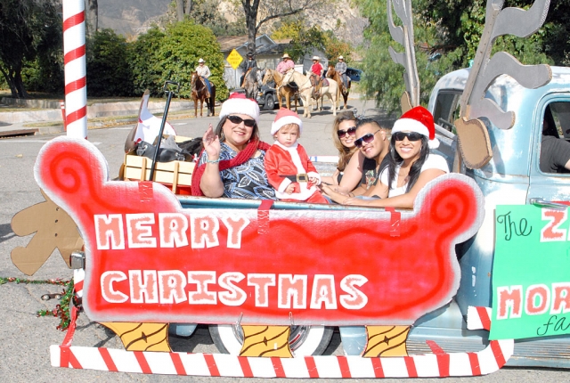 Piru held their annual Christmas Parada last Saturday, December 11. Piru had wonderful weather and the parade was enjoyed by the spectators. Above the Zavala and Morales Family take a sleigh ride down Main Street. Parade Winners were (Courtesy Maria Troyke): Band - 
1st place, Fillmore High School Band
2nd place, Fillmore Middle School
Group category (2 first place winners) -
1st place, San Salvador Church
1st place, Piru’s Full Circle Learning Preschool
2nd place, The Zavala & Morales Family
Child category -
1st place, Robert Marquez Jr
2nd place, Chessani Family
Adult category -
1st place, Mr. Zavala
2nd place, no enrty
Equestrian -
1st place, The Torres’s and Guest
2nd place, Martin & Isabel Arredondo