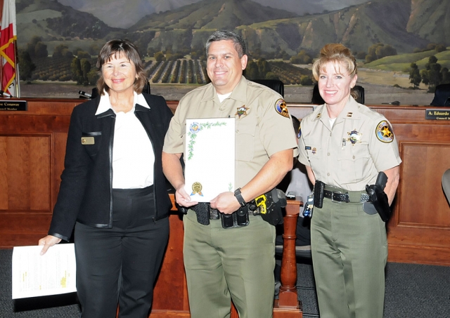 Mayor Gayle Washburn presented Deputy Brian Hackworth (center) a proclamation for his services in Fillmore. Hackworth was also 2011 Officer of Year, (right) Fillmore Police Chief Monica McGrath.