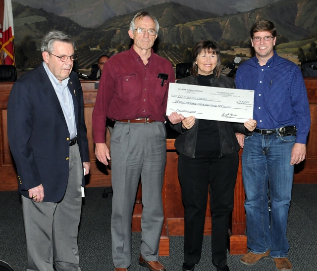 At Tuesday night’s council meeting, the City of Fillmore was presented a check from the Fillmore Rotary Sun Risers. Presenting the check for $7310 was Don Gunderson (left), John Scoles (middle), Mayor Gayle Washburn, and Sean Morris (right).