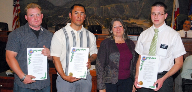Pictured above are David Brown, Jose Mendez, Mayor Patti Walker, and Benjamin Pratt. They were commended for administering emergency CPR to a jogger who had collapsed on June 1st.