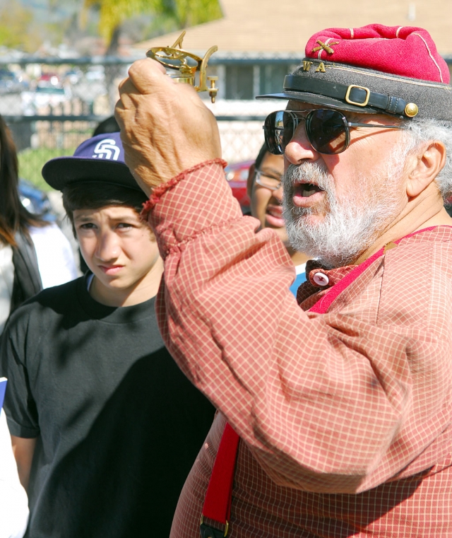 A Civil War instructor shows authentic period pieces to Fillmore Middle School students.