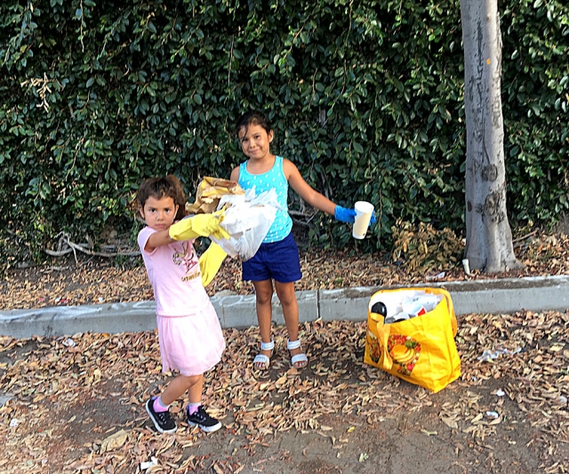 Fillmore cousins, Alexis Amaro, 7, and Destiny Amaro, 5, are learning about keeping their Fillmore community clean by volunteering to pick up trash that disrespectful people dump in public places. They were seen cleaning up the public parking area east of Central Avenue behind downtown businesses. Hopefully the idea of “Volunteer Clean Up” will spread faster than the spreading of trash. Great job girls! You should be proud.