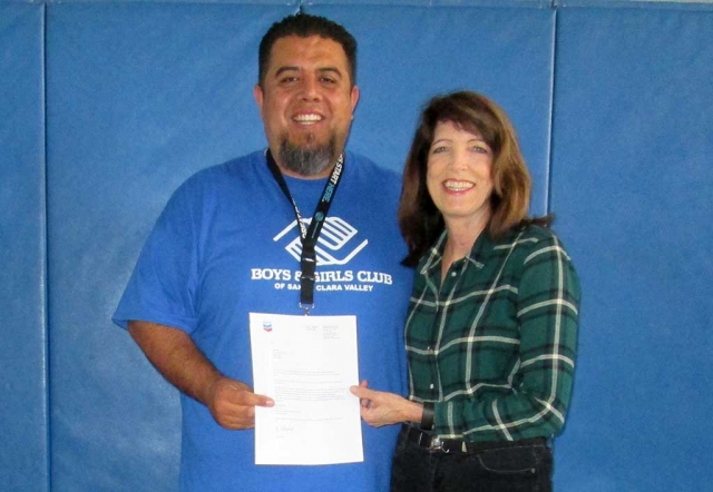 (left) Buddy Escoto, Site Director for the Fillmore Site of the Boys & Girls Club of Santa Clara Valley receiving a check for $5000 from Leslie Klinchuch, Project Manager for Chevron. The funds will be used to continue the high quality STEM (Science, technology, engineering and math) programs being implemented at the Club. Thank you Chevron!
