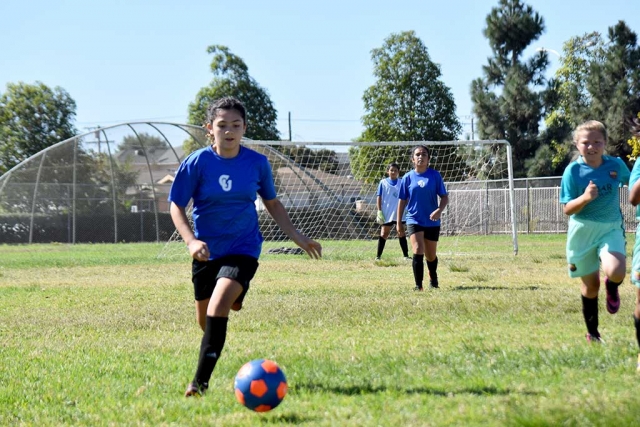 One of California United’s speedsters, Athena Sanchez, runs around the Barcelona midfielder to pressure the defense. Submitted by Coach Tony Hernandez.