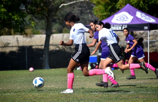 Pictured is a California United 2006 Girls Silver North player as she tries to make her way past the defense and up the field in their game against LA Surf. Photos courtesy Rebecca Halcon.