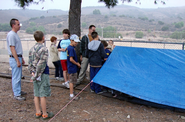 The Weblos learn how to construct a temporary shelter.