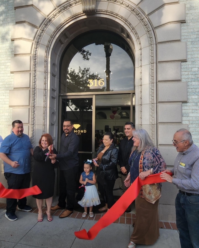 On Friday, June 3rd, Diamond Realty hosted a grand opening and ribbon cutting for their new location in Fillmore’s Historical Landmark 47, the old bank building at the corner of Central Avenue and Main Street. After the ribbon cutting folks were welcomed inside to enjoy refreshments and local artwork displayed throughout the building.