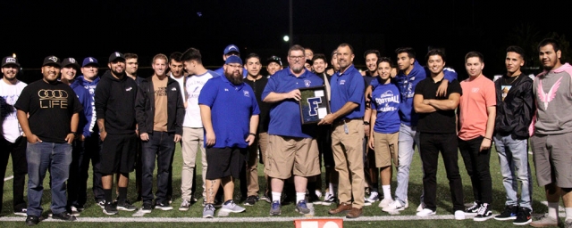 Last Friday, October 26th at the Flashes game, former FHS Head Football Coach Matt Dollar was presented with a shadow box with a patch of the original turf and a Letterman F for all his years of dedication to the Flashes Football program. Picture is Mr. Dollar along with FHS Principal John Wilber and former Flashes players and coaches. Photo courtesy Crystal Gurrola.