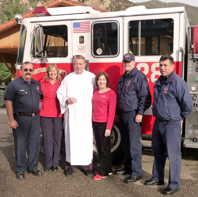 Pictured (l-r) Engineer Fred Ponce (VCFD Station 28), Virginia Obenchain (FTT), Father Barney, Paula Cornell (Co-founder of FTT), Fireman/Paramedic Jason Buckley (VCFD Station 28), Captain Danny Rodriquez (VCFD Station 28).