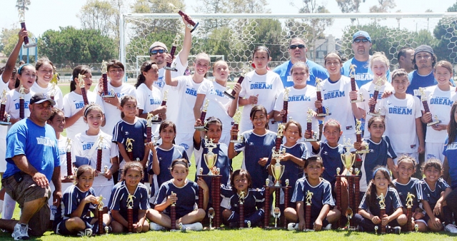 On Sunday, August 22, The Fillmore Dream Soccer Club player’s were presented with trophies. First Place went to 12U and 8U and Second place went to 10U. The girls participated in the Oxnard Police Activities Summer Soccer League which lasted three months. Pictured above but not in order are: 12&U- Head Coach Jose Vaca, Assistant’s: Gabriel Tobias, Luis Negrete, Omero Martinez, and Al Garnica. Players: Calista Vaca, Reylene Martinez, Talia Negrete, Esmerada Murillo, Emily Garnica, Jada Avila, Denise Vasquez, Ryan Nunez, Emily Armstrong, Priscilla Carbajal, Sara Stewart, Rachel Rivers, Salma Gomez, and Aviana Ramirez. 10&U: Head Coach Anel Lopez, players: Gracie Tope, Ariana Magana, Jessica Tamayo, Angelica Orozco, Andrea Marruffo, Mya Ramirez, Nataly Lomeli, Yareli Vasquez, Stephany Magana, Valerie Tobias. 8&U Head Coach Ram Tobias and Damian Magana, players: Isabella Vaca, Jaylinn Magana, Esther and Maria Ruvalcaba, Serena Velez, Aalyih Lopez, Anica Ramirez, Alexis Mejia, Anica Lopez, Celeste Ordaz, and Jasmin Hinojosa. The 12&U team would like to thank the Fillmore Lions Club for the help with purchasing uniforms.