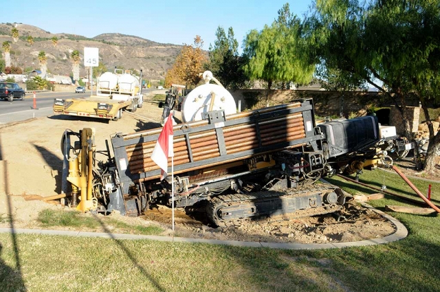 This photo shows Taft Electric's directional drilling rig at work, drilling under Highway 126 in order to place electrical lines for the new Mountain View traffic light. According to Raymond Brown Sr., who pushed long for the project, work is proceeding quickly. A handicap ramp and other corner work is under way.