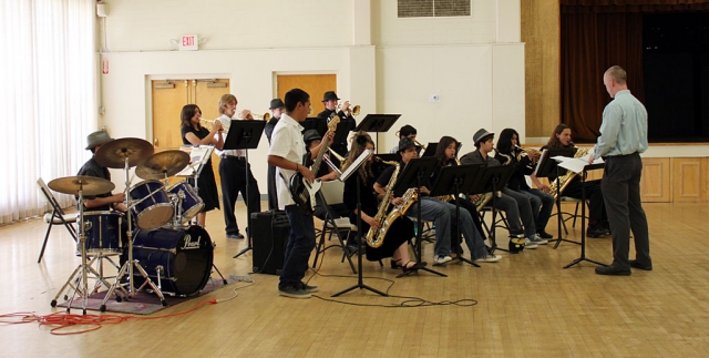 FHS band director Greg Godfrey conducts the Jazz Band for the Ebell Club meeting.