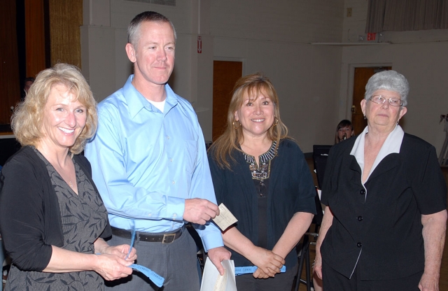 Ebell Club presented a $1,000 check to FHS and Middle School Band Director Greg Godfrey, to be used for new uniforms. Pictured (l-r) are Debra Galarza, Godfrey, Debbie Sanchez, and President Fay Swanson.