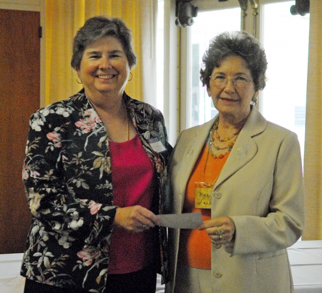 Martha Gentry, President of the Fillmore Historical Society, seen here accepting a $500.00 donation from Fillmore Ebell Club President, Mary Ford.