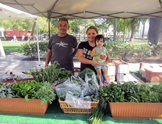Albert Baltazar with his daughter-in-law Sandra and grand-daughter at the Fillmore Community Farmers Market.