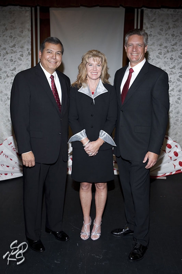 Fillmore’s Soroptimist Fashion Show Mistress of Ceremonies, Fillmore Police Chief Monica McGrath with escorts Fillmore Fire Chief Rigo Landeros and husband Jack McGrath, a Ventura County Sheriffs Detective.