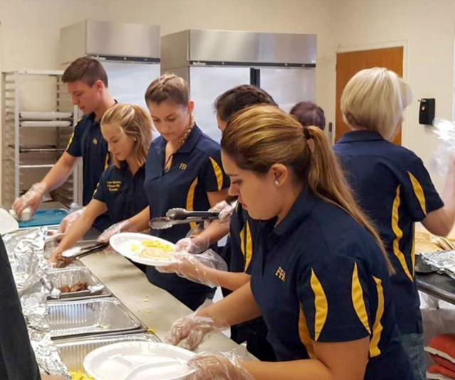 On Wednesday, July 4th the Fillmore FFA will host their Annual Freedom Breakfast at the Veterans Memorial Building from 7am – 9:30pm. Pictured above are FFA students who worked during last year’s fundraiser.