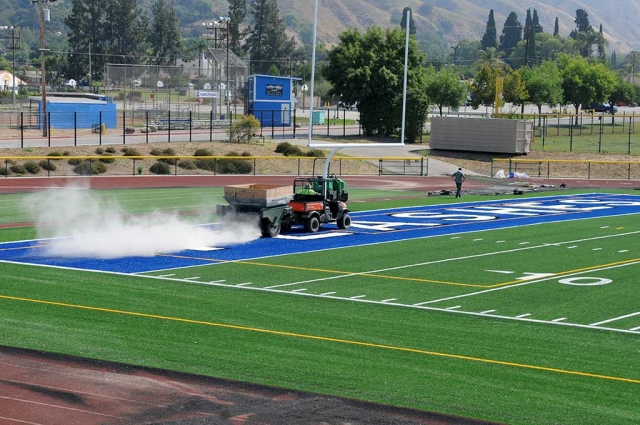 Despite the crazy summer heat this maintenance team is working hard to get the field done before the 2018 football season begins.