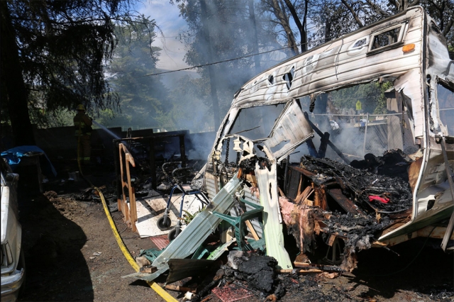 Fillmore Fire Department assisted Ventura County Fire last Wednesday, with a fire in the 4400 block of Santa Paula Ojai Road, near Mupu School. The fire apparently started near a small trailer, pictured above. The trailer was destroyed, two other vehicles were engulfed, and a large Pine tree was consumed. The fire was reported at 1:40 p.m., and knocked down by 2 p.m. One man received moderate to severe burns and was transported to a hospital. Photo courtesy Sebastian Ramirez.