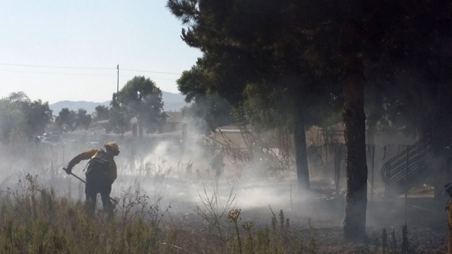 Saturday, September 5th at 4:17pm a fire broke out behind the River Ridge Apartment complex on River Street. Fillmore Fire Department had the blaze under control in approximately a half an hour, with only minor damages caused to the surrounding area. No houses were damaged and cause of the fire is still under investigation. Inset are crews clearing some of the burned vegetation and searching for any hot spots that might reignite. 