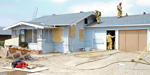 The Fillmore Fire Department hosted an instruction event Friday in which the Oxnard Fire Department participated. The above house and garage off of Highway 126, near E Street, was systematically burned in stages throughout the day in order to permit firefighters to practice their skills. The different phases of a structure fire were experienced under real conditions.