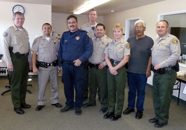 Above, Law enforcement turned out for Tuesday’s Police Storefront Christmas. Sheriff Geoff Dean is pictured far left, (r-l) Deputy Leo Vazquez, Community Resource Officer Max Pina, and Fillmore Sheriffs Capt. Monica McGrath, with Fillmore deputies and probation officer.