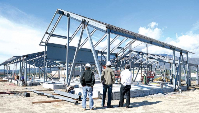 The county’s new $9-million fire station at River Street and C Street is developing on time. Pictured here, the architect, project manager, and owner-contractor, checking things out. The rain has caused some time loss, but no one would dare complain about that. Construction should be completed by the end of the year. All steel workers are local.