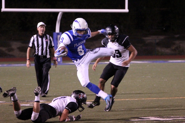 #9 Dominick Gonzalez Leaps over a defender for a first down. Photos courtesy Crystal Gurrola.