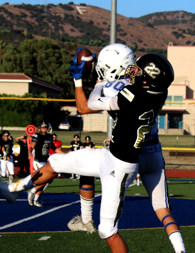 The Fillmore Flashes JV and Varsity Football are back! The Flashes hosted a scrimmage against Oak Park Eagles this past Friday, August 16th, to get ready for the 2019 season. Pictured right is Flashes Varsity #60, as he leaps up to make the catch mid-air during Friday’s game against the Eagles. Varsity fell short to Oak Park with a final score 18 – 0. Pictured below are Flashes JV #49 and #45, as they put stop an Oak Park player to keep him from advancing up the field. Final score for JV has not yet been reported. Fillmore Flashes JV will host Channel Islands on Thursday, August 22nd at 5 p.m. Varsity will play away at Viewpoint on Friday, August 23rd at 7 p.m. Photos courtesy Crystal Gurrola.