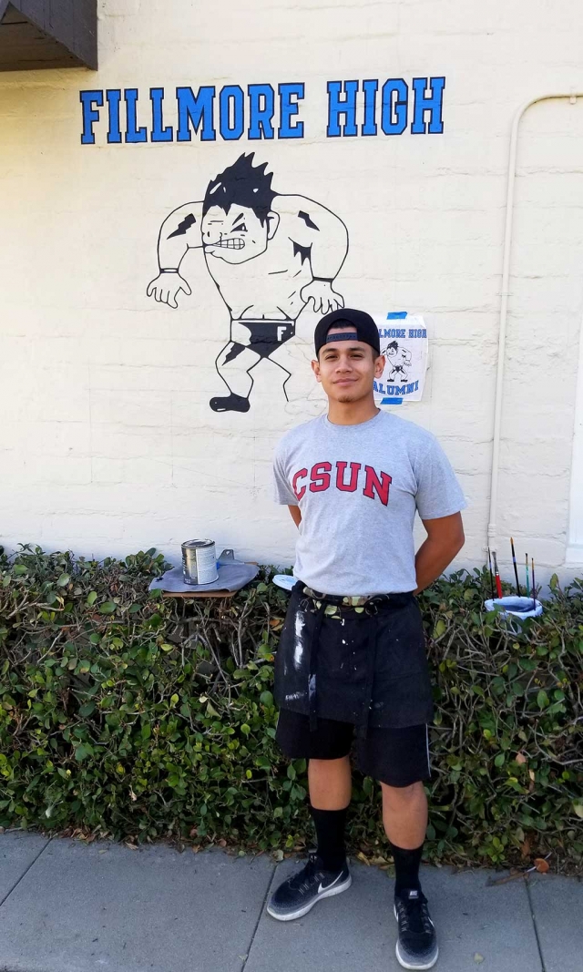 Esteban Vasquez Fillmore High Class of 2011, drew the mural on the side of the FHS Alumni Building.