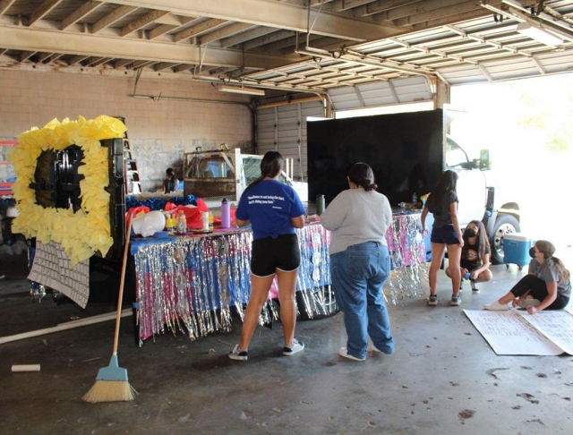 Fillmore High School celebrated Homecoming this past week, and to prepare for the big game FHS students participated in Dress-Up Days, lunch time activities and the Fillmore tradition of float building. This past week at the Fillmore bus garages students from each grade, and staff gathered while following COVID-19 guidelines, to prepare their floats for the Homecoming Parade and Fillmore’s Blue & White Night. Photo courtesy Angel Esquivel-AE News.