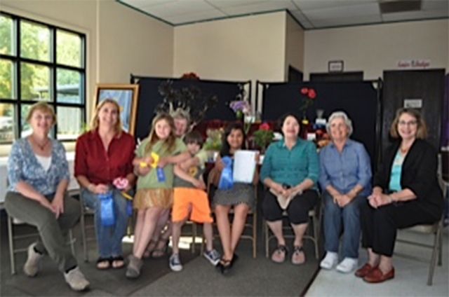 Fillmore Flower Show winners in no order Blanca Martinez, Joy Asenas, Regina Stehley, Carmen Zermeno, Linda Nunes, and Loni Larson.