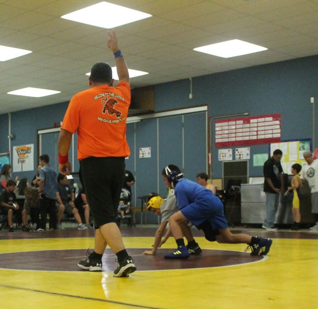 The Fillmore Middle School Wrestling team has been busy over the last two weeks competing in local tournaments at Fremont Middle School in Oxnard and at Isbell Middle School in Santa Paula. The next event will be a 4-team home meet at Fillmore Middle School on Wednesday, October 3rd. The Bulldogs will host Balboa, Sinaloa, and Soria Middle Schools. Wrestling is scheduled to begin at 5:30 pm and conclude at 7:30 pm. Admission to the event is free. Pictured above is Fillmore wrestler Devin Camacho as he dominates during his match at the Fremont Tournament. Story and photos courtesy Coach Michael Torres.