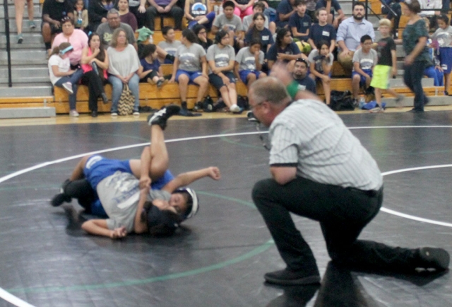 The Fillmore Middle School Wrestling Team recently competed at Sinaloa Middle School in Simi Valley. Other schools that competed in the 4-team competition included Isbell Middle School and Soria Middle School. The results are as follows: Emma Torres 2-0, Alexa Martinez 1-1, Devin Camacho 0-1, Meya Garcia 0-1, and Jonathan Patino 0-1. Pictured above is Fillmore’s Emma Torres during her match in Simi Valley taking down her opponent. Photos courtesy Coach Michael Torres.