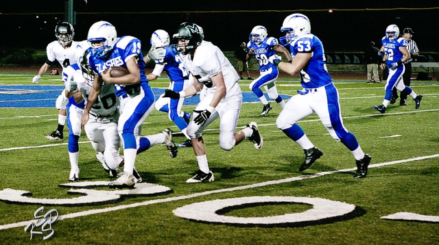 Daniel Cruz (#19) trys to stay away from Malibu’s defense with the help of Brandon Pina (#63). Pina attributed 9 tackles to the game. Also, Sammy Orozco had 7 tackles and Joseph De La Mora had 12 tackles. According to Coach Dollar, “We had too many penalties. For many of the players it was their first Varsity start. We still have many things that we need to improve on.”